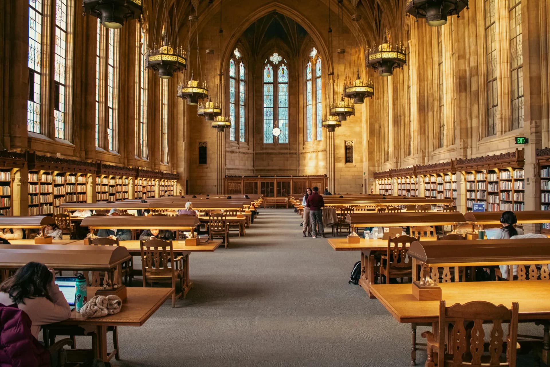 Historic university reading room with long study tables